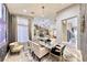 Well lit formal dining room features modern finishes and natural light at 7311 Chaparral Cove Ln, Las Vegas, NV 89131