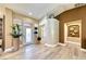 Bright, open foyer with elegant flooring, high ceilings, and stylish decor at 7311 Chaparral Cove Ln, Las Vegas, NV 89131