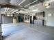 Well-organized garage with ample storage space, built-in cabinets, and a clean epoxy floor for functionality and style at 7311 Chaparral Cove Ln, Las Vegas, NV 89131
