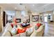 Bright living room with wood floors, fireplace, and open layout to the dining area at 7311 Chaparral Cove Ln, Las Vegas, NV 89131