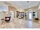 Open concept layout with wood floors, dining area, and great natural light at 7311 Chaparral Cove Ln, Las Vegas, NV 89131