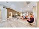 Large open-concept living space with light wood floors, vaulted ceilings, and abundant natural light at 7311 Chaparral Cove Ln, Las Vegas, NV 89131