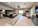 Serene main bedroom featuring a vaulted ceiling, plush carpeting, and a seating area with an abundance of space at 7311 Chaparral Cove Ln, Las Vegas, NV 89131