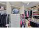 Organized walk-in closet with custom storage solutions, including a television, and ample space at 7311 Chaparral Cove Ln, Las Vegas, NV 89131