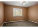 Carpeted bedroom featuring a ceiling fan and bright window with white shutters at 7340 Elderly Ave, Las Vegas, NV 89131