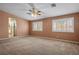Spacious carpeted bedroom with two windows and a ceiling fan at 7340 Elderly Ave, Las Vegas, NV 89131