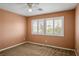 Bedroom featuring carpet, windows, and blinds at 7340 Elderly Ave, Las Vegas, NV 89131