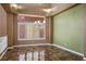 Traditional dining room with marble floors, chandelier lighting, and modern window shutters at 7340 Elderly Ave, Las Vegas, NV 89131