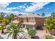 Stunning two-story home featuring a three-car garage and beautiful desert landscaping at 7340 Elderly Ave, Las Vegas, NV 89131