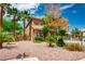 Beautiful two-story home showcasing desert landscaping, mature palm trees, and an inviting facade at 7340 Elderly Ave, Las Vegas, NV 89131