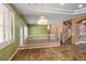 Open-concept living area with marble floors, staircase, and open view to the kitchen at 7340 Elderly Ave, Las Vegas, NV 89131