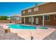 Backyard pool and patio area with a covered porch at 7340 Elderly Ave, Las Vegas, NV 89131