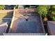 Aerial view of a spacious backyard featuring a brick-paved patio and a basketball hoop at 777 Star Apple Ln, Las Vegas, NV 89178