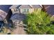 Aerial view of a well-maintained home with a tile roof, brick driveway, and mature landscaping at 777 Star Apple Ln, Las Vegas, NV 89178