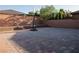 A spacious backyard featuring a brick-paved patio, brick wall, and a basketball hoop at 777 Star Apple Ln, Las Vegas, NV 89178