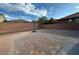Large brick backyard, perfect for entertaining, includes a basketball hoop and privacy wall at 777 Star Apple Ln, Las Vegas, NV 89178