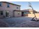 A spacious backyard featuring a brick-paved patio, brick wall, and a basketball hoop at 777 Star Apple Ln, Las Vegas, NV 89178