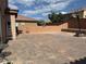 Spacious backyard featuring a basketball court and brick retaining walls for landscaping at 777 Star Apple Ln, Las Vegas, NV 89178