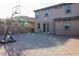 A spacious backyard featuring a brick-paved patio, brick wall, and a basketball hoop at 777 Star Apple Ln, Las Vegas, NV 89178