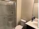 Clean bathroom with glass shower door, toilet, and vanity at 777 Star Apple Ln, Las Vegas, NV 89178