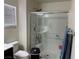 Modern bathroom with glass-enclosed shower and window at 777 Star Apple Ln, Las Vegas, NV 89178