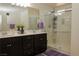 Bright bathroom featuring double sinks, sleek cabinets, and a large glass-enclosed shower for a spa-like experience at 777 Star Apple Ln, Las Vegas, NV 89178