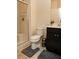Bathroom features a glass enclosed shower and dark cabinets at 777 Star Apple Ln, Las Vegas, NV 89178