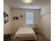 Neat bedroom with a twin bed, closet, and wall decor at 777 Star Apple Ln, Las Vegas, NV 89178