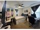 This bedroom features a bed, workspace with computers and decorations under modern ceiling fan at 777 Star Apple Ln, Las Vegas, NV 89178