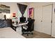 Bedroom featuring a desk, a bed, and a sliding-door closet providing ample storage space at 777 Star Apple Ln, Las Vegas, NV 89178