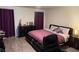 Cozy bedroom with a comfortable bed, dark furniture, and ample natural light through the curtains at 777 Star Apple Ln, Las Vegas, NV 89178