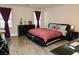 Inviting bedroom showcasing a comfortable bed, sleek furniture, and bright, natural light from large windows at 777 Star Apple Ln, Las Vegas, NV 89178