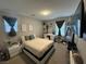 Bedroom with comfortable bed, natural light, stylish decor, and a convenient makeup vanity at 777 Star Apple Ln, Las Vegas, NV 89178