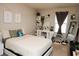 Inviting bedroom featuring a comfortable bed, vanity, shelves, and decorations for a cozy atmosphere at 777 Star Apple Ln, Las Vegas, NV 89178