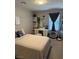 Bedroom featuring a plush bed, vanity, and soft lighting at 777 Star Apple Ln, Las Vegas, NV 89178