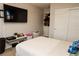 Bright bedroom featuring a comfortable bed, a large television and closet at 777 Star Apple Ln, Las Vegas, NV 89178
