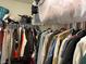 Organized walk-in closet with hanging clothes, shelves, and storage solutions for optimal space utilization at 777 Star Apple Ln, Las Vegas, NV 89178