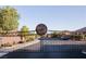 Gated entrance to Laurel Hills, showcasing a secure and well-maintained community with lush landscaping at 777 Star Apple Ln, Las Vegas, NV 89178