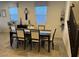 Dining room featuring a dark wood table, six chairs and natural light at 777 Star Apple Ln, Las Vegas, NV 89178