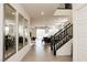 Inviting entryway featuring wood-look tile flooring, mirrors, and open access to the living and dining areas at 777 Star Apple Ln, Las Vegas, NV 89178