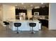 Kitchen featuring a large center island, dark cabinets and modern appliances at 777 Star Apple Ln, Las Vegas, NV 89178