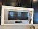 Close-up of a Whirlpool microwave installed above a cooking range at 777 Star Apple Ln, Las Vegas, NV 89178