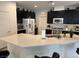 Kitchen featuring a large center island, dark cabinets and stainless steel appliances at 777 Star Apple Ln, Las Vegas, NV 89178