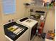 Functional laundry room with washer, dryer, shelving, and storage for an organized home at 777 Star Apple Ln, Las Vegas, NV 89178