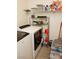 Functional laundry room featuring a washer, shelving, and storage containers at 777 Star Apple Ln, Las Vegas, NV 89178