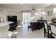 Bright, open-concept living space featuring modern furnishings and sleek tile flooring, ideal for entertaining at 777 Star Apple Ln, Las Vegas, NV 89178