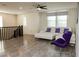 Bright living area featuring an L-shaped sofa and hardwood style floors at 777 Star Apple Ln, Las Vegas, NV 89178