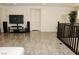 Spacious living area featuring hardwood floors and a modern entertainment center with a flat screen TV at 777 Star Apple Ln, Las Vegas, NV 89178