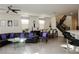 Bright living room featuring modern decor, a black leather sofa, and an adjacent dining area with stylish chairs at 777 Star Apple Ln, Las Vegas, NV 89178