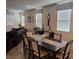 Open-concept living space with dining room and a dark leather sofa at 777 Star Apple Ln, Las Vegas, NV 89178